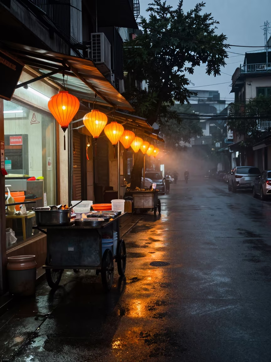 Wet Pavement Glow Street Vendor Hanoi Morning in outside a fluorescent convenience store in Hanoi