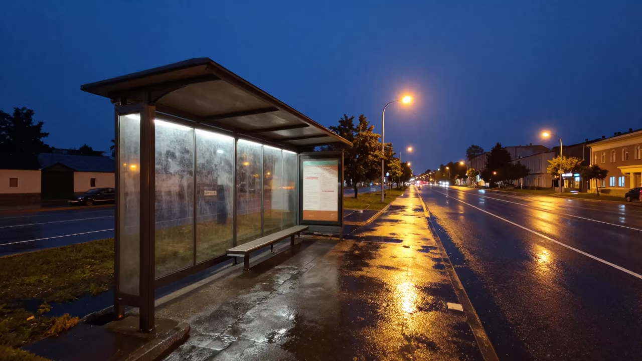 Wet Pavement Reflects Diner Glow in Petropavl Night in beside a steamed-up bus shelter in Petropavl