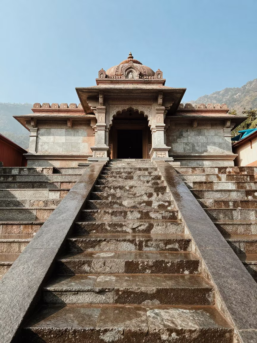Wet Stone Ghats Reflecting Sky After Rain in at a shrine entrance in India
