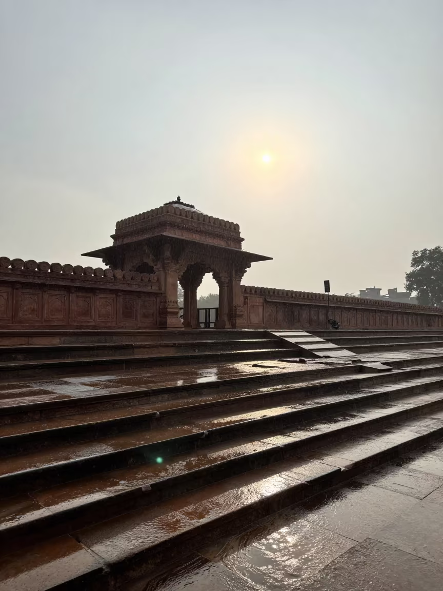 Wet Stone Ghats Reflecting Sky After Monsoon Rain in at a shrine entrance near Lajpat Nagar, Delhi