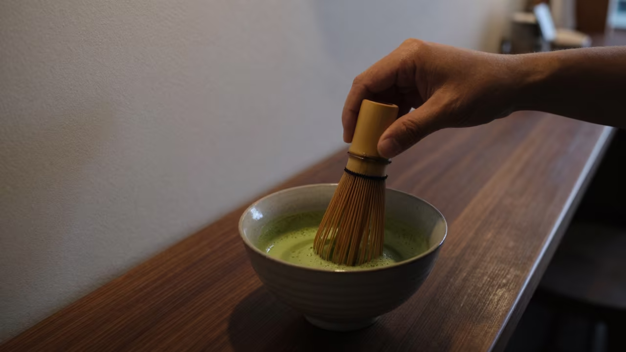 Whisked Matcha Tea at Sunrise Counter in at a coffee bar counter in Amravati