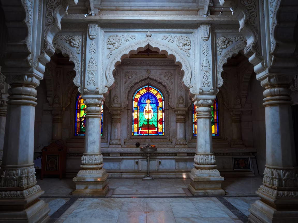 White Marble Jain Temple Interior Night Light in in a chapel lit by stained glass in Howrah, Kolkata