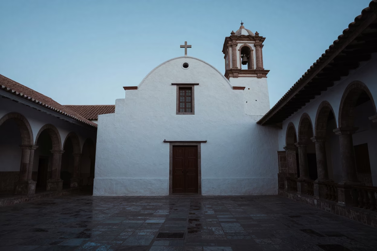 Whitewashed Chapel Silhouette in Cusco Market Twilight in inside a quiet cloister passage in San Pedro Market, Cusco