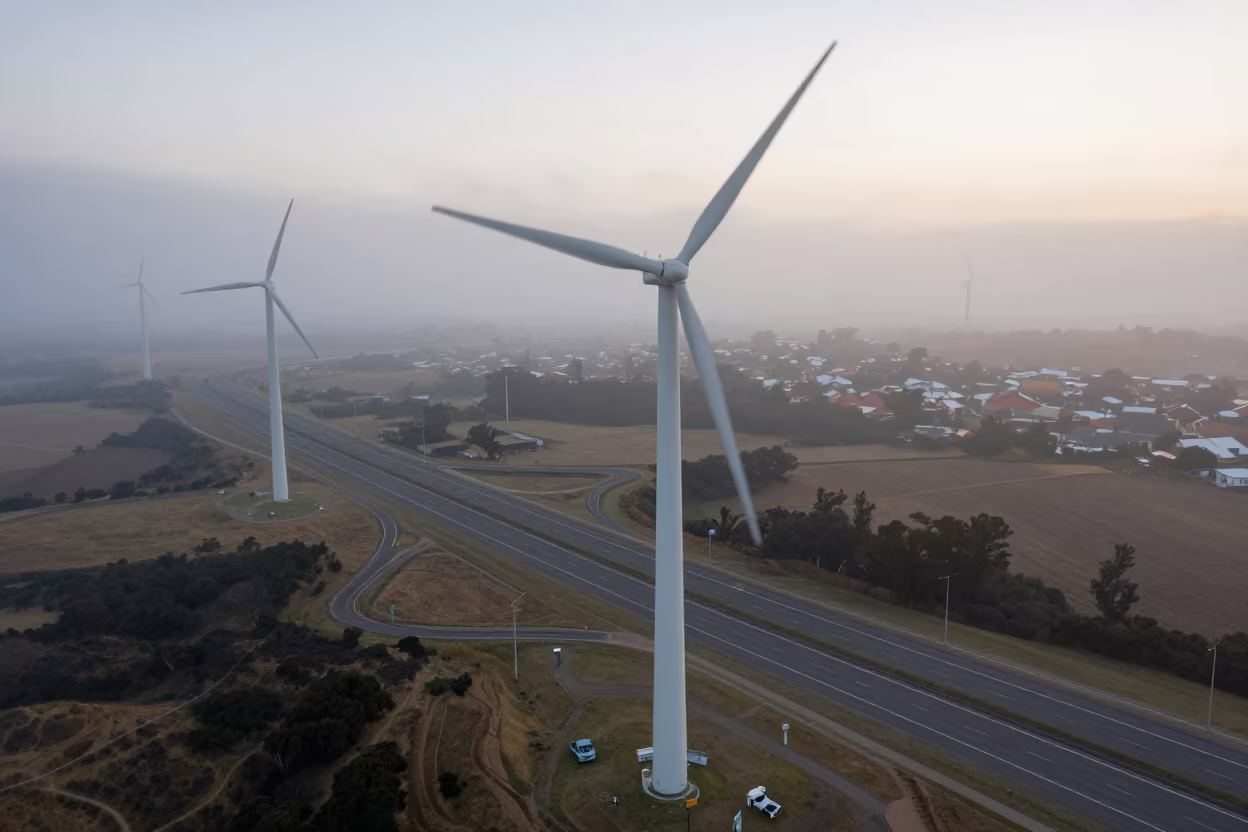 Wind Farm Beside Motorway After Sunrise in across a windy overpass interchange near Soweto
