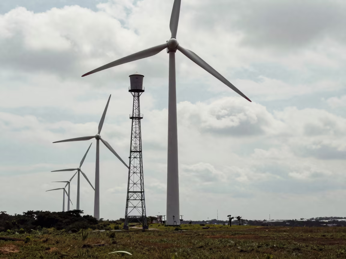 Wind Farm Met Mast Beside Turbines in São Paulo in beside a water tower ladder in São Paulo