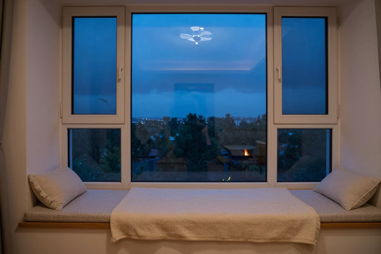 Window Seat Nook With Wool Blanket and Storm Outside Taiyuan in by a crackling fireplace near Taiyuan