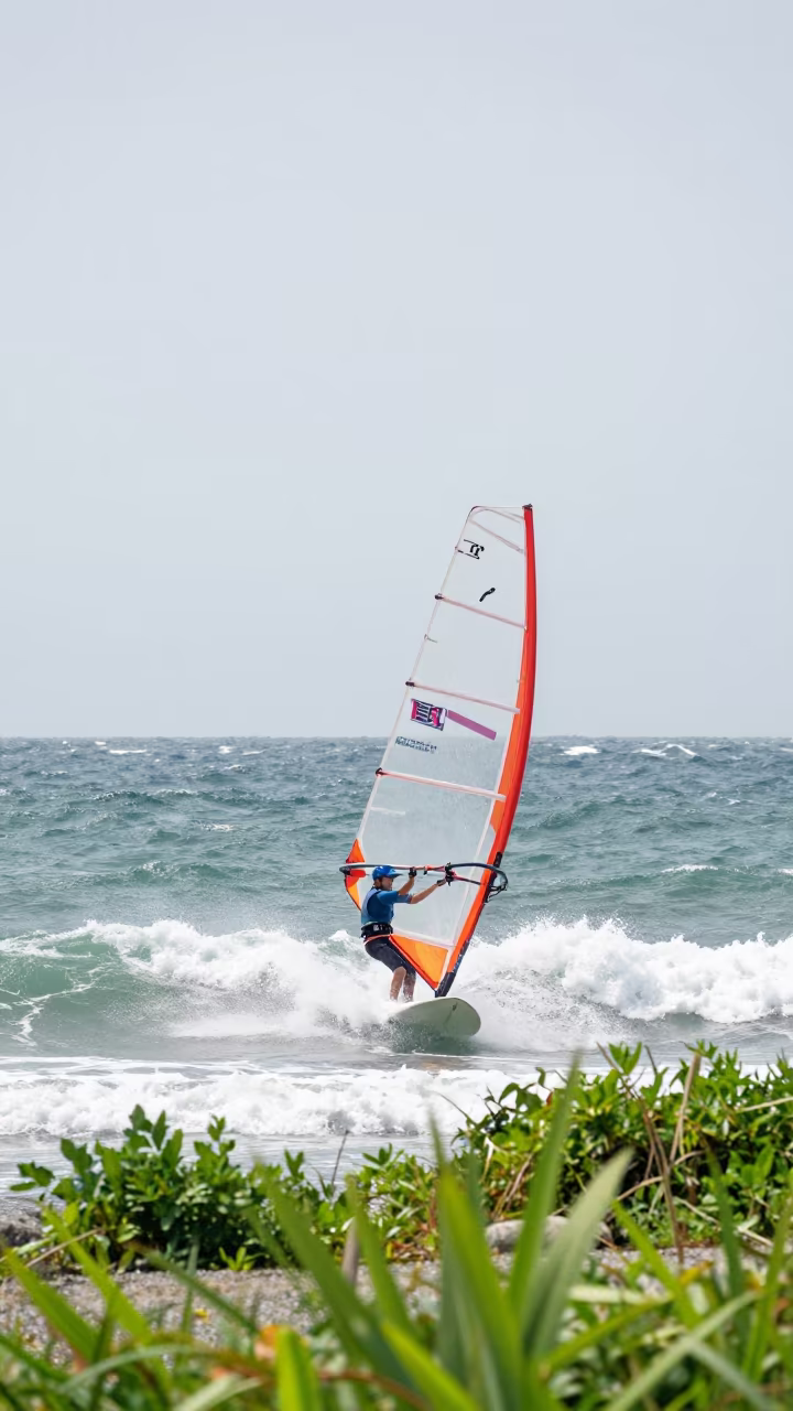 Windsurfer Launching Chop Wave Near Kanazawa in at a roadside stop near Kanazawa