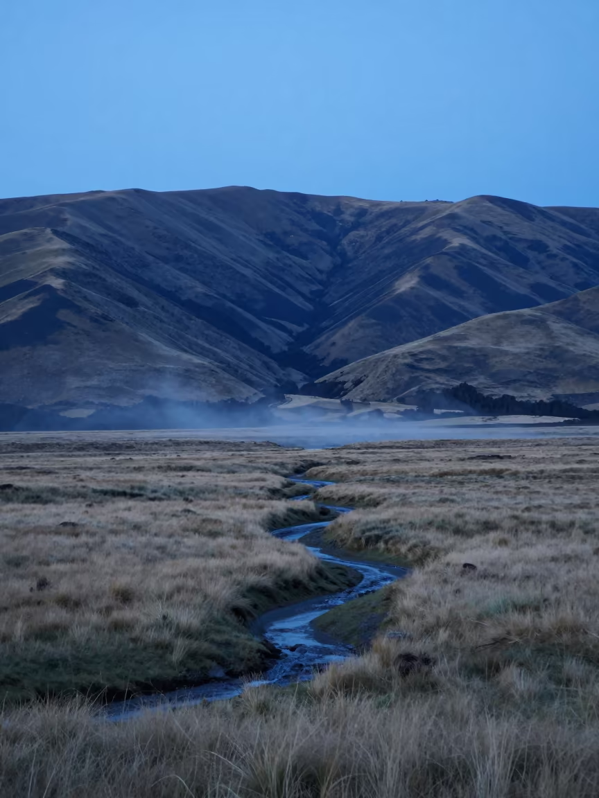 Windy Plateau Storm Runoff New Zealand Blue Hour in from a ridge above layered foothills in New Zealand