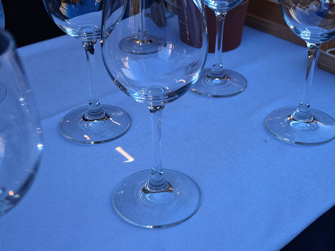 Wine Glass Light Play on Linen in Avignon in at a market stall counter in Avignon