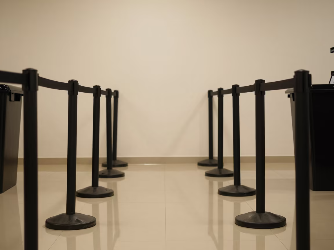 Winter Checkout Queue Stanchion with Muted Reflections in at a checkout lane under flat store light near Elazığ