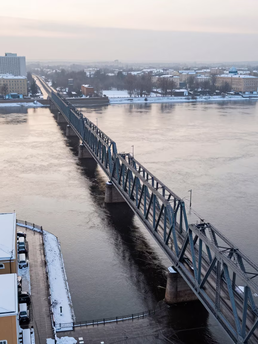 Winter Dawn Bridge Over City River Russia in beside a canal-front facade in Russia
