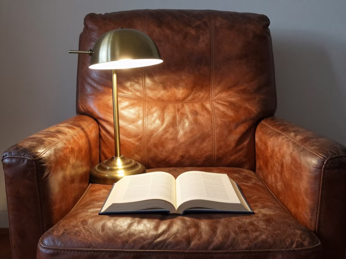 Winter Evening Lamp on Worn Leather Chair in on a worn leather armchair near Kotri