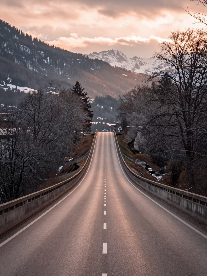 Winter Levee Road Overpass in Copper Dusk Light in across a windy overpass interchange in Innsbruck