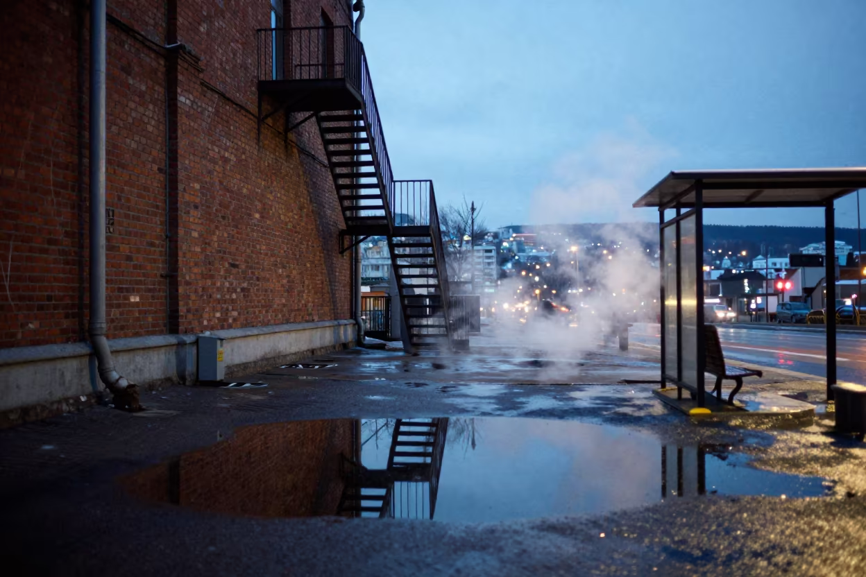 Winter Puddle Reflection Fire Escape Vladivostok in beside a steamed-up bus shelter in Vladivostok
