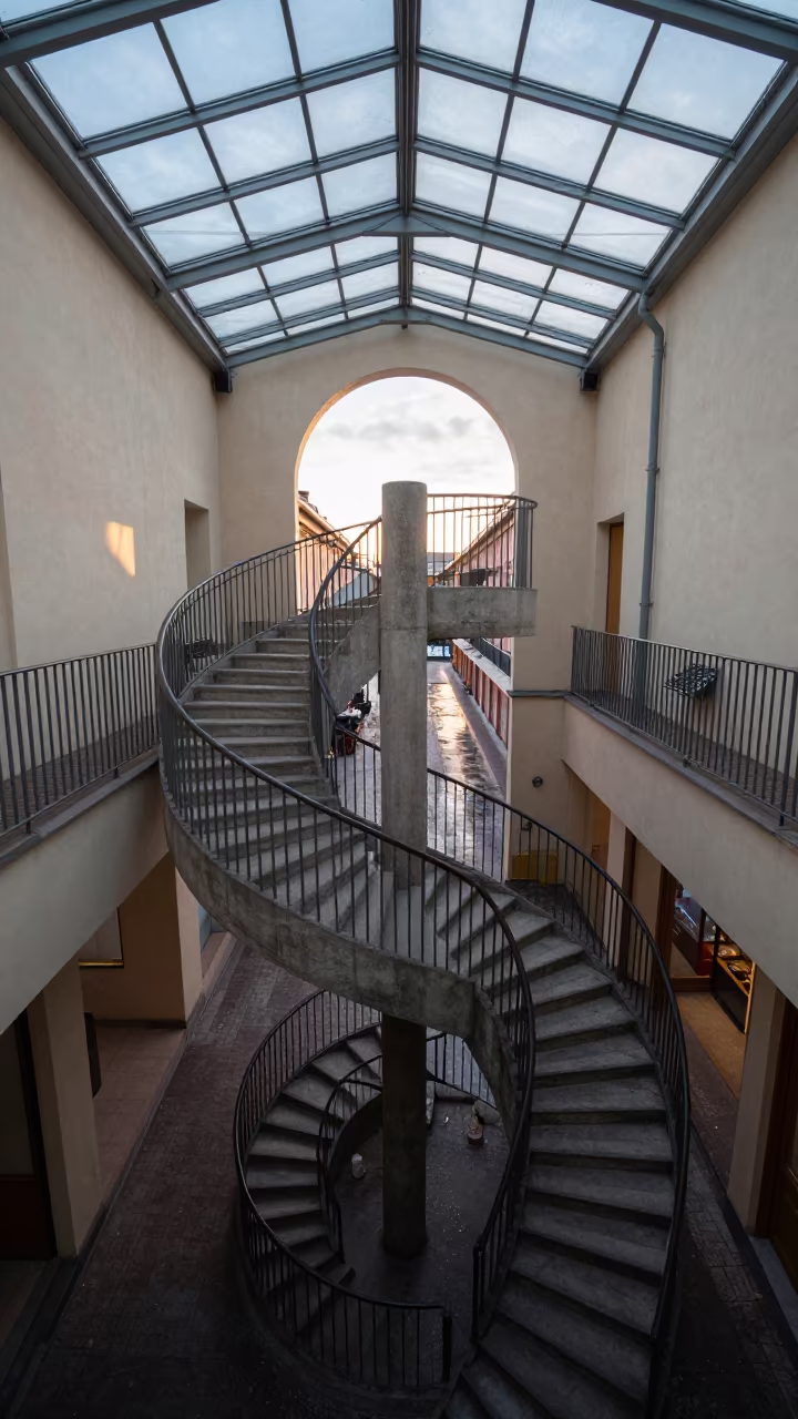 Winter Staircase Spiral Glass Arcade Vantaa in inside a glass-roofed arcade in Vantaa