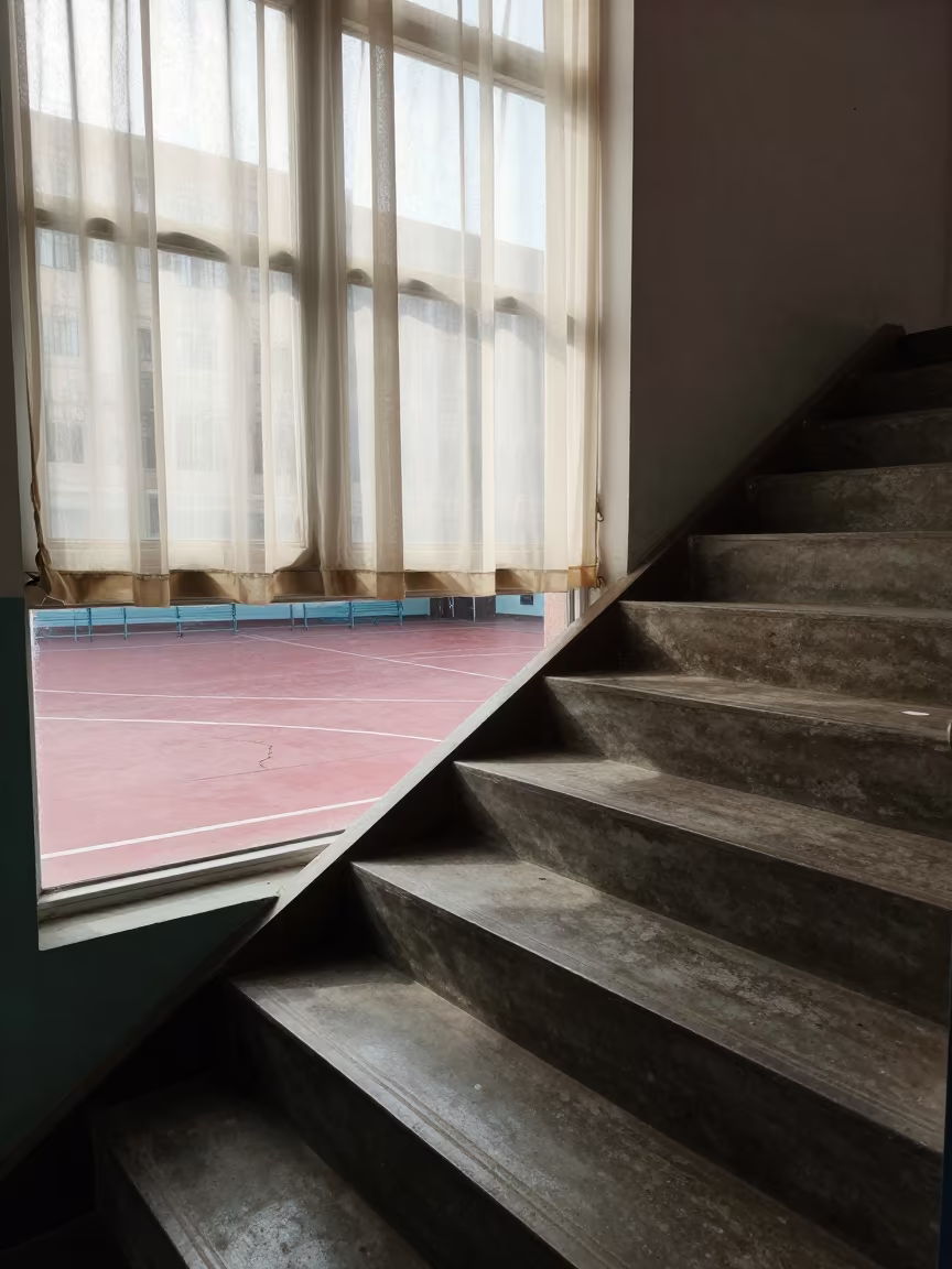 Winter Sunlight on School Staircase Overlooking Court in inside a quiet classroom in Kut