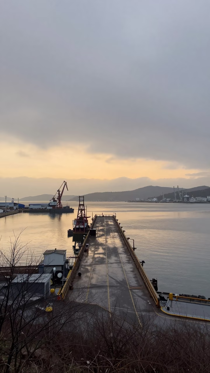 Winter Sunset Ore Dock Over Jagalchi Harbor in across a wide valley floor near Jagalchi, Busan