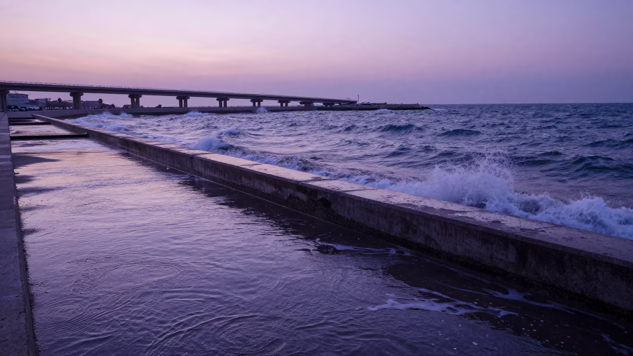 Winter Surf Against Sicilian Sea Wall Twilight in across a windy overpass interchange in Sicily