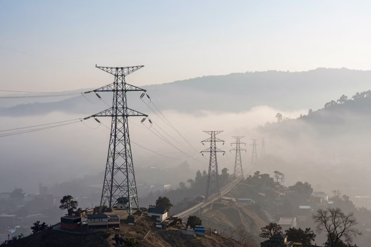 Winter Transmission Towers Ridge Kathmandu Valley Fog in under a cable-stayed bridge span near Kathmandu