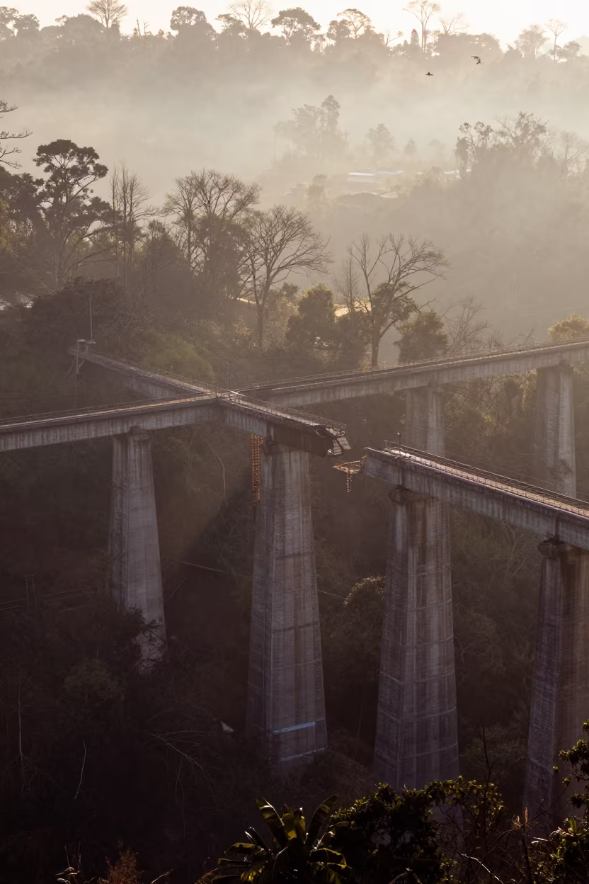 Winter Viaduct Silhouette Over Misty Colombian Valley in along a bridge maintenance walkway in Colombia
