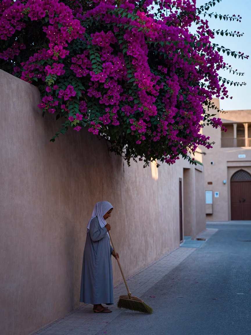 Woman Sweeping in Muscat in in Muscat, Oman