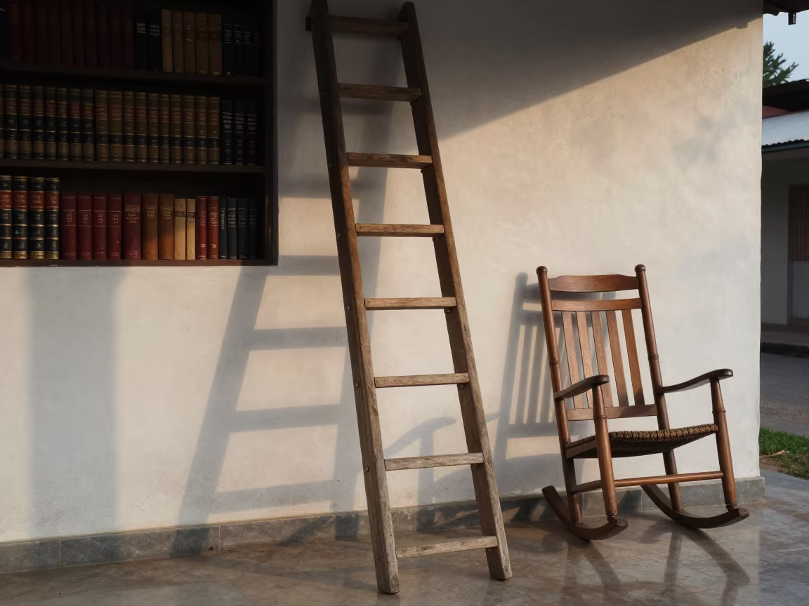 Wooden Ladder Leaning Against Leather Books on Porch in on a porch with a rocking chair near Lubango