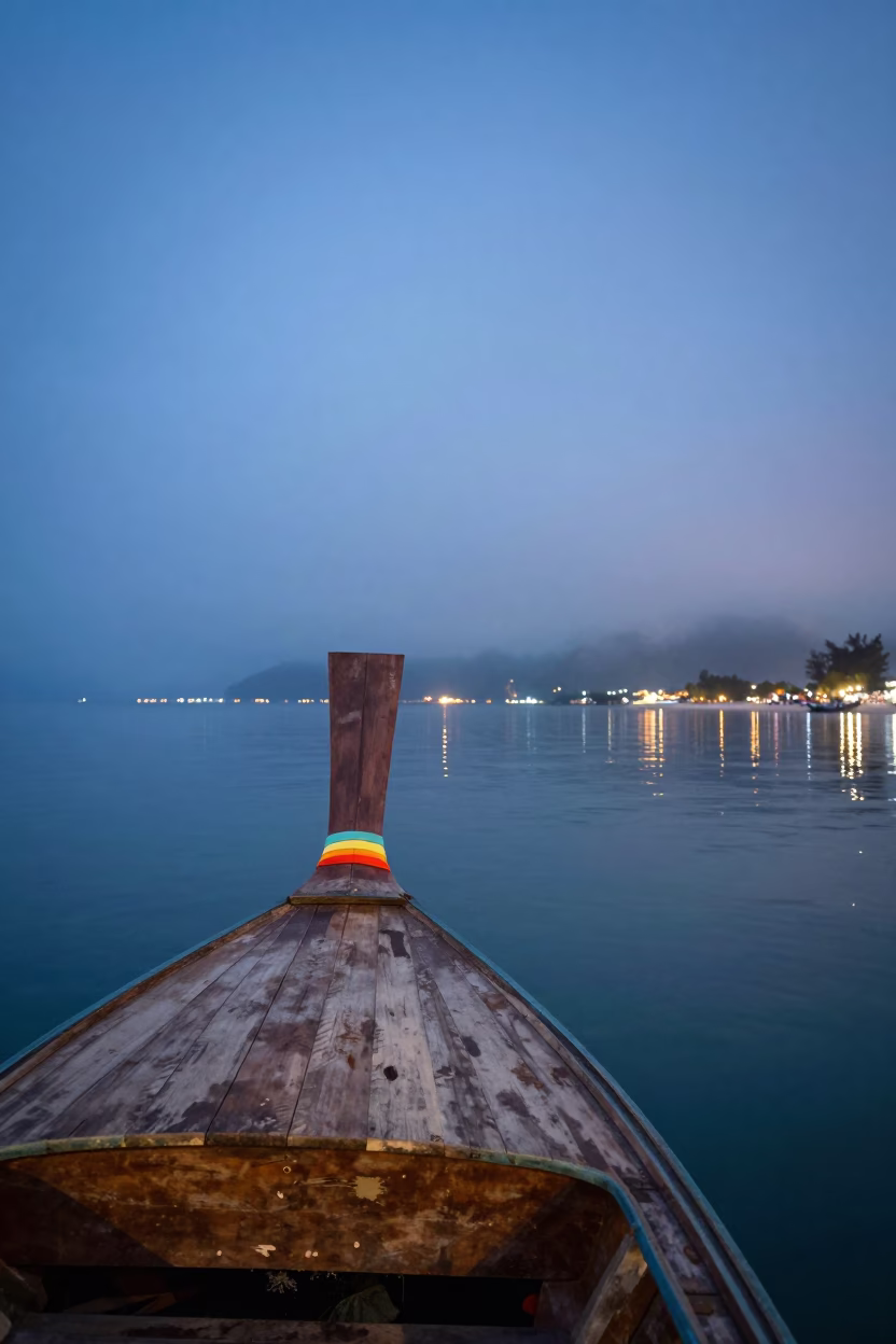 Wooden Longtail Boat at Foggy Phuket Harbor in beside a fogbound harbor mouth near Phuket