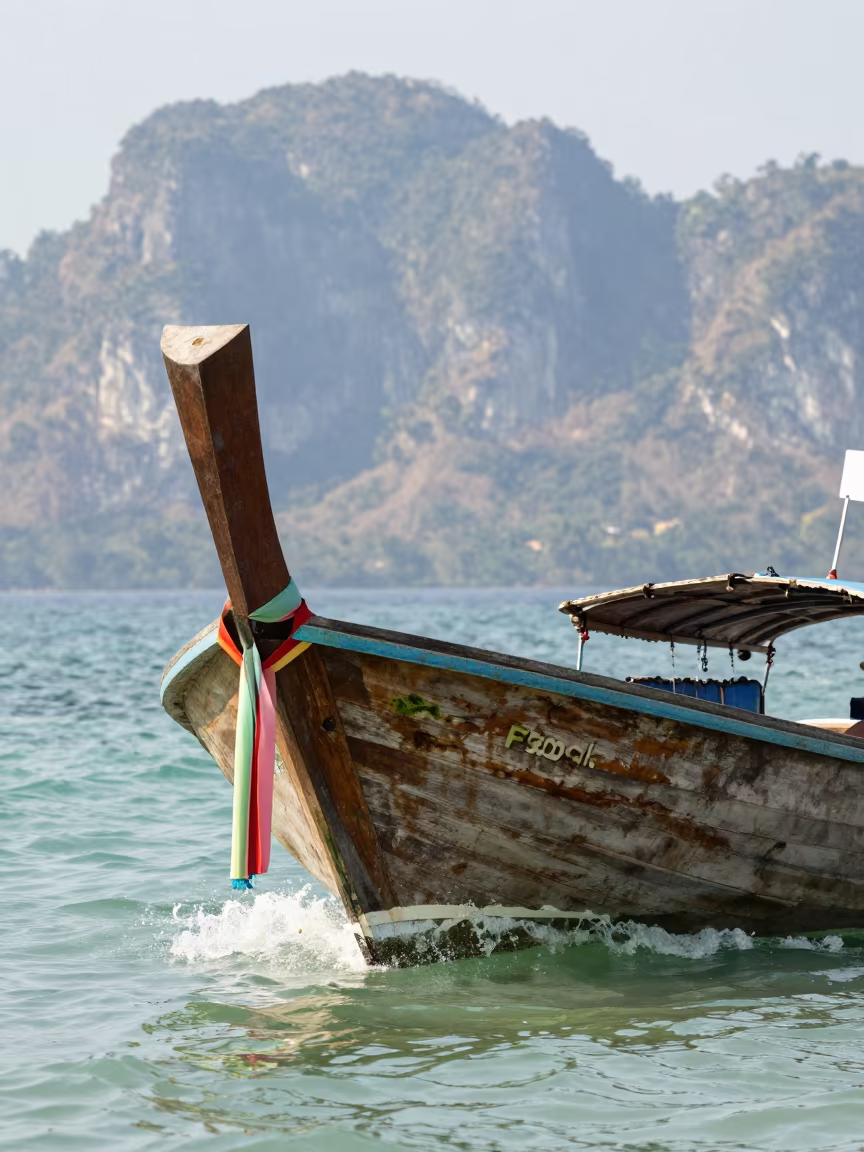 Wooden Longtail Boat in Thai Lagoon in in Thailand