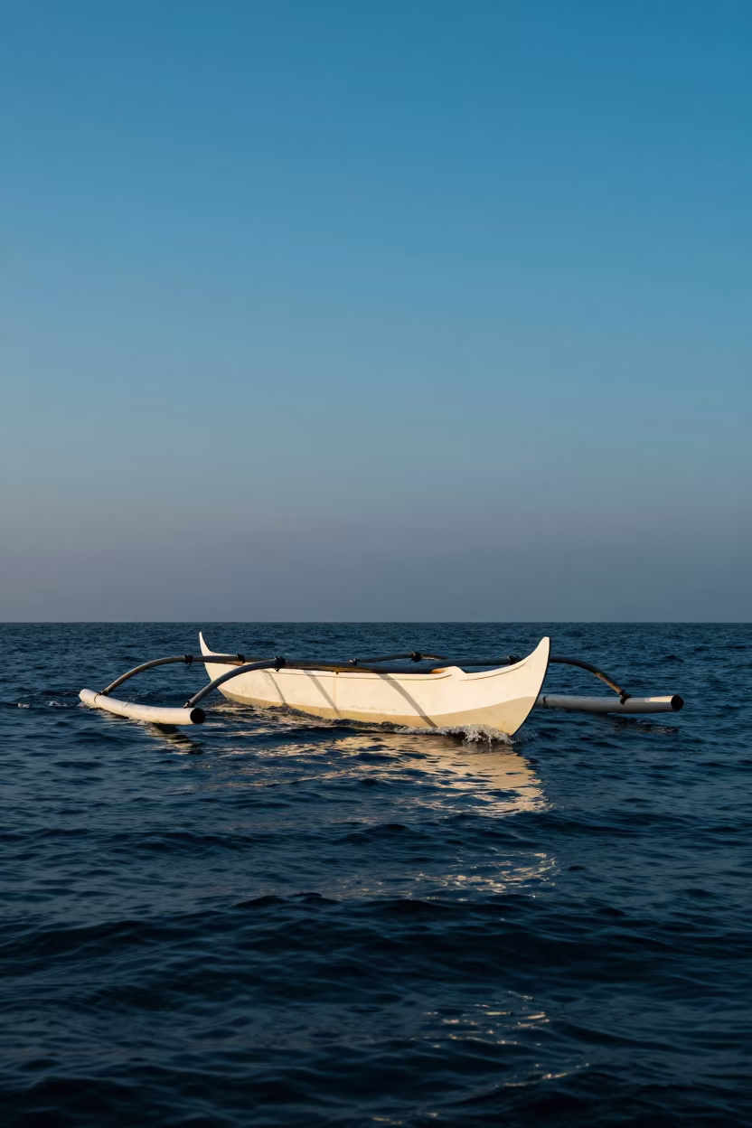 Wooden Prau Boat in Twilight Waters in along a switchback approach in Indonesia