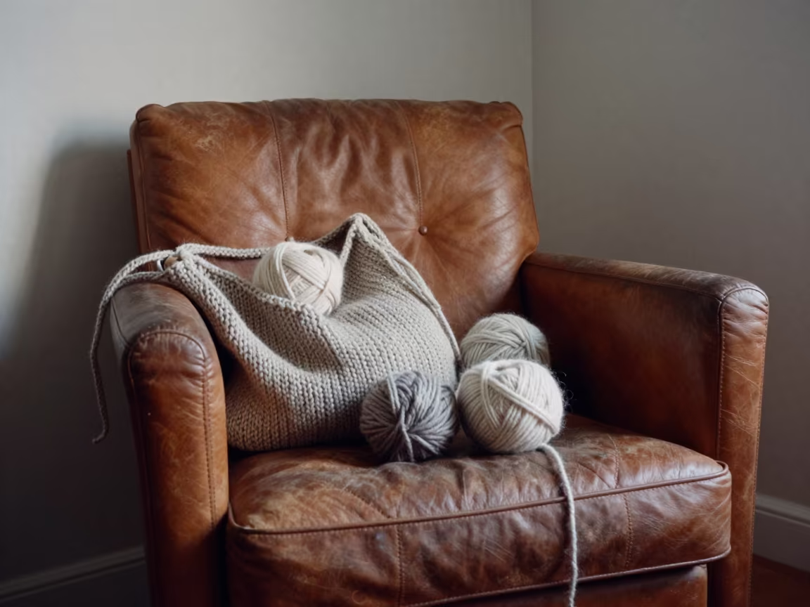 Wool Spilling from Bag on Leather Bench in Bilbao in on a worn leather armchair in Bilbao
