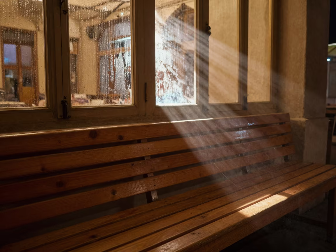Worn Bulb Planter on Slatted Bench at Night in on a cafe table by a window in Shiraz