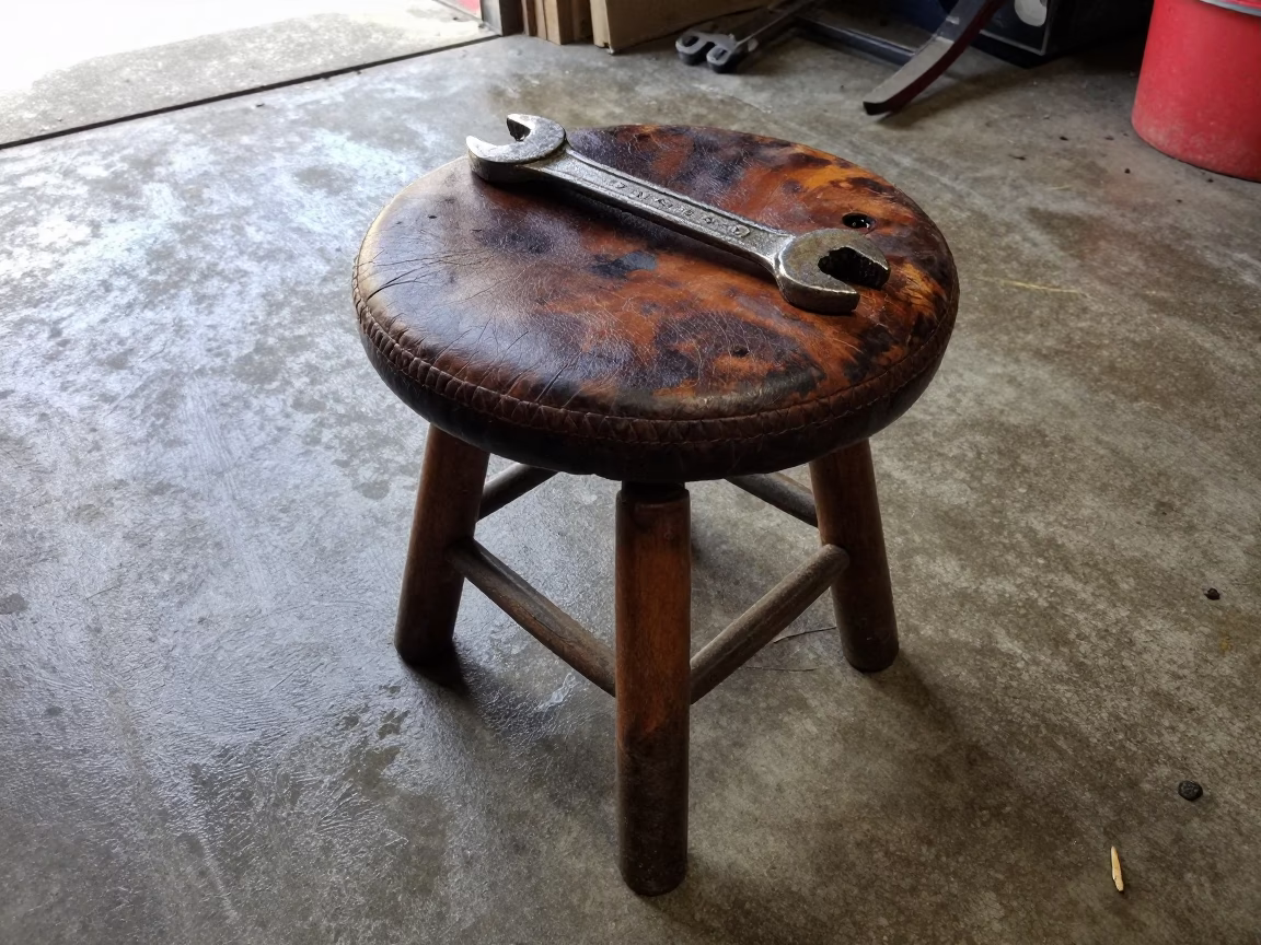 Worn Leather Work Stool in Portland in in Portland, United States