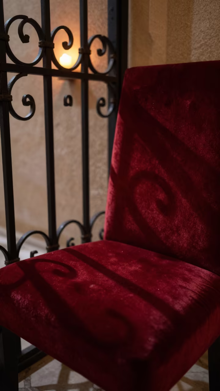 Wrought Iron Gate Shadows on Velvet Chair in on a velvet chair in Baghdad