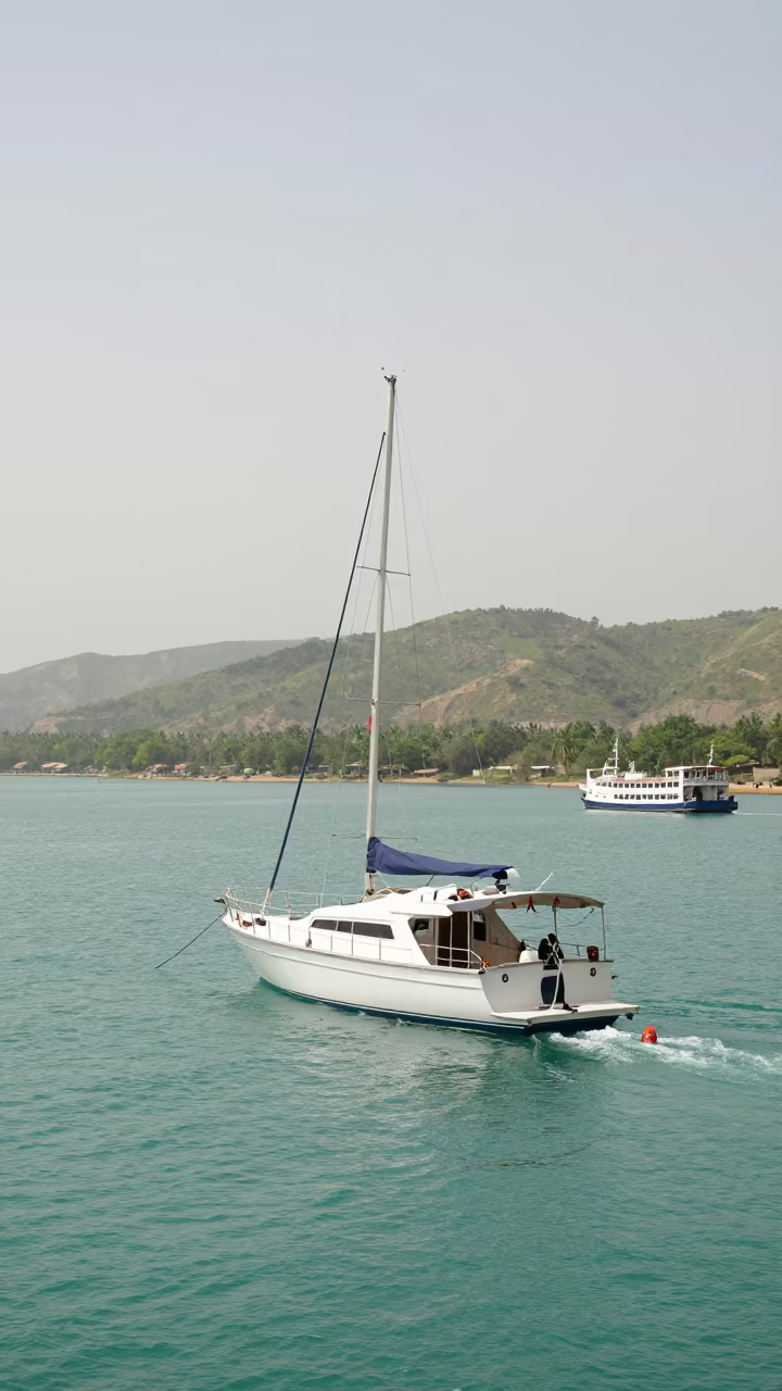 Yacht Anchored Turquoise Bay Green Hills in across a remote ferry crossing near Multan