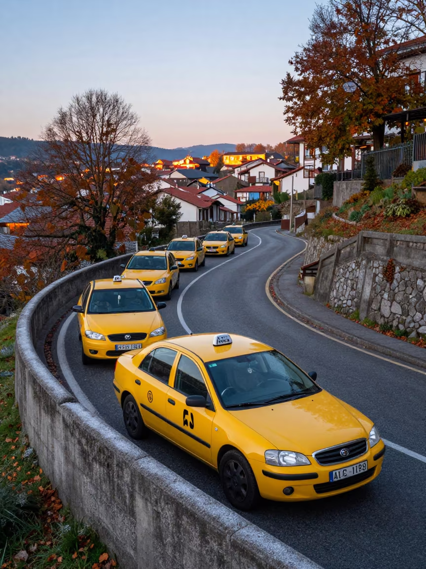 Yellow Taxis on Asturias Switchback at Dusk in along a switchback approach in Asturias