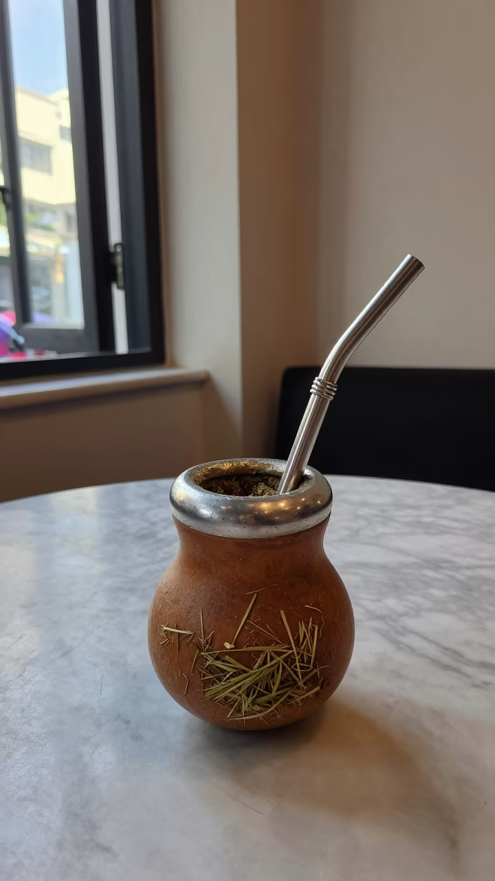 Yerba Mate Gourd on Marble Table Morning Light in on a marble cafe table in Ho Chi Minh City