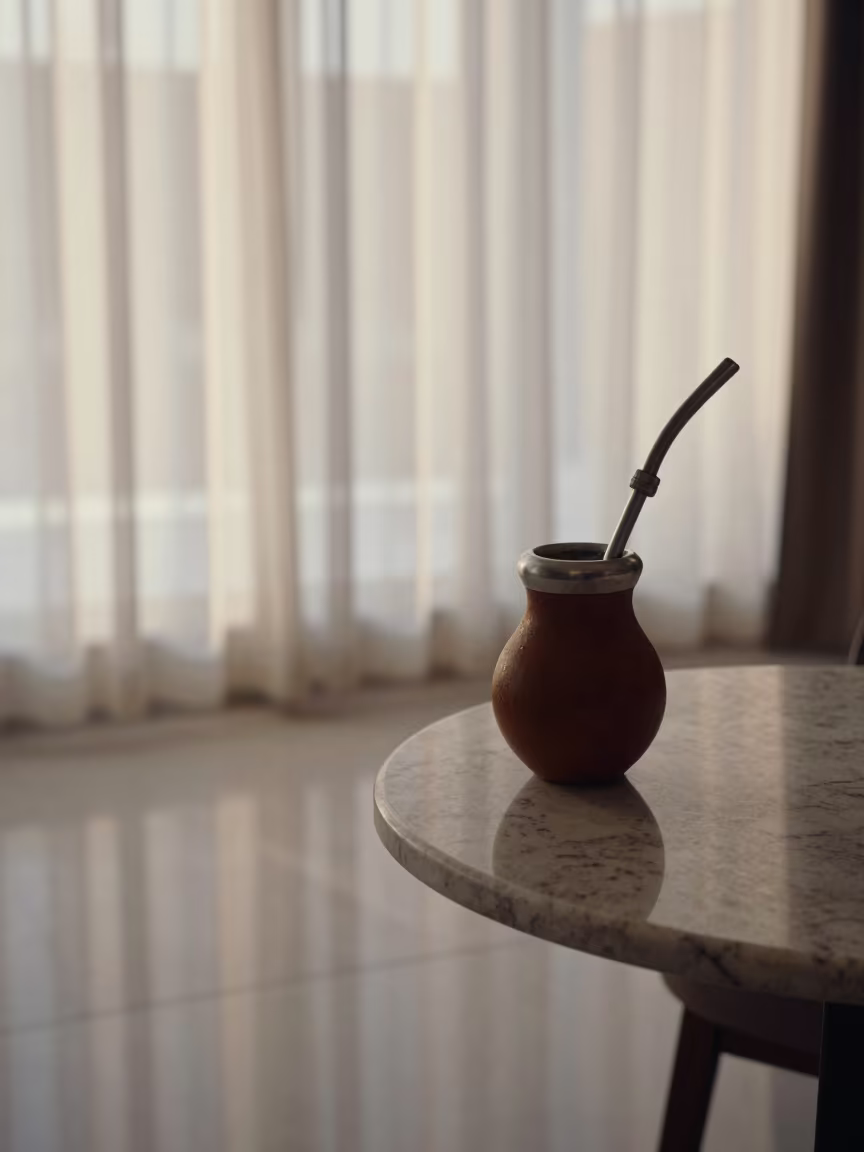 Yerba Mate Gourd on Marble Table Before Sunrise in on a marble cafe table in Riyadh