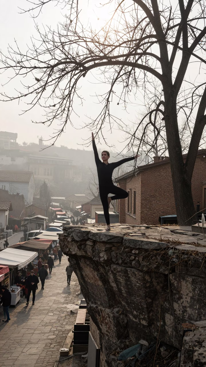Yoga Practitioner on Tbilisi Cliff Edge Mist in along a market lane in Tbilisi