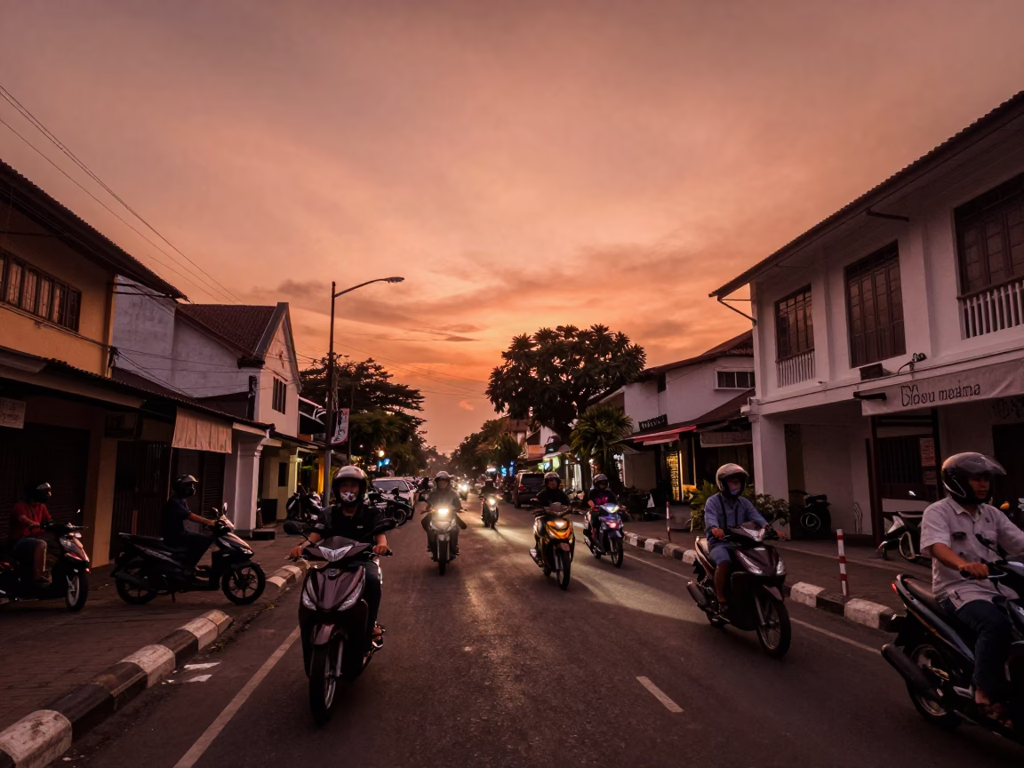 Yogyakarta Indonesia Before Dusk Copper Light Street Scene with Motorcycles and Local Architecture in in Yogyakarta, Indonesia