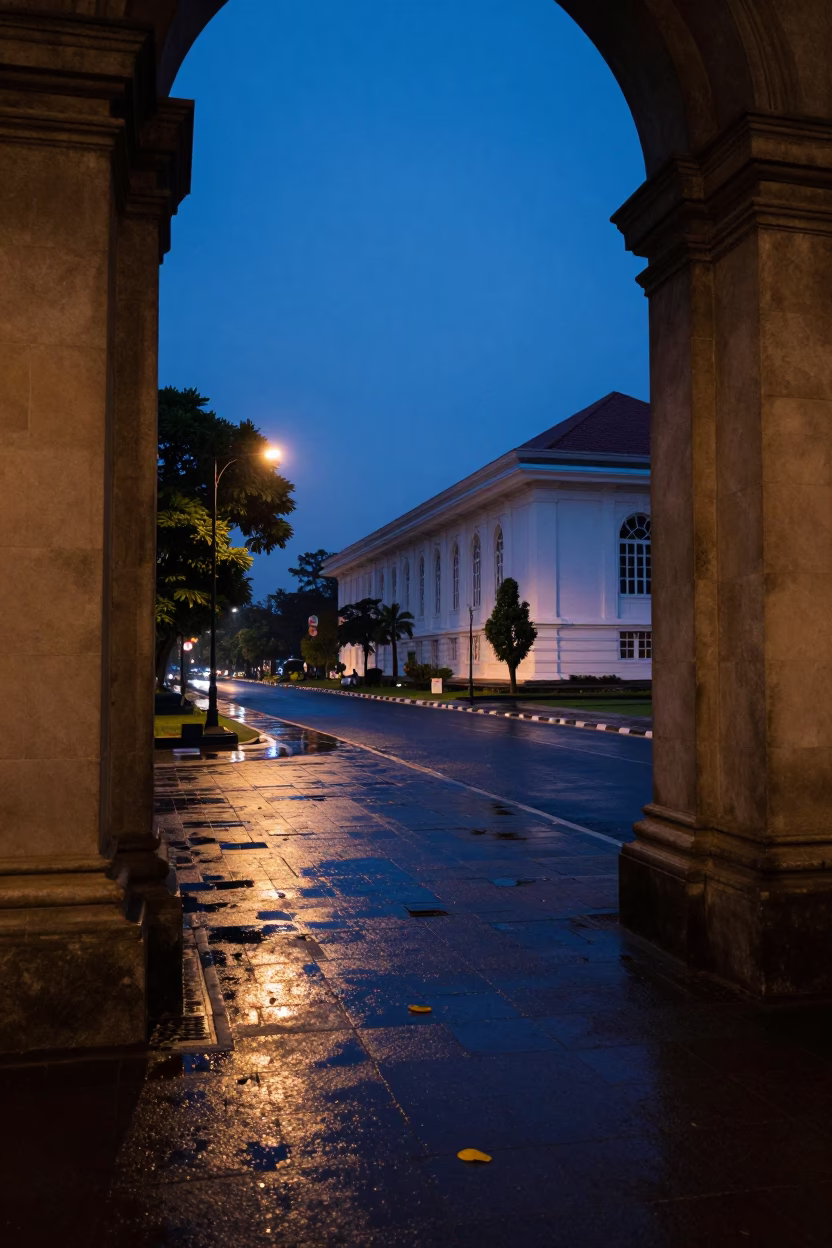 Yogyakarta Indonesia indigo twilight street scene with wet leaves and local commerce in in Yogyakarta, Indonesia