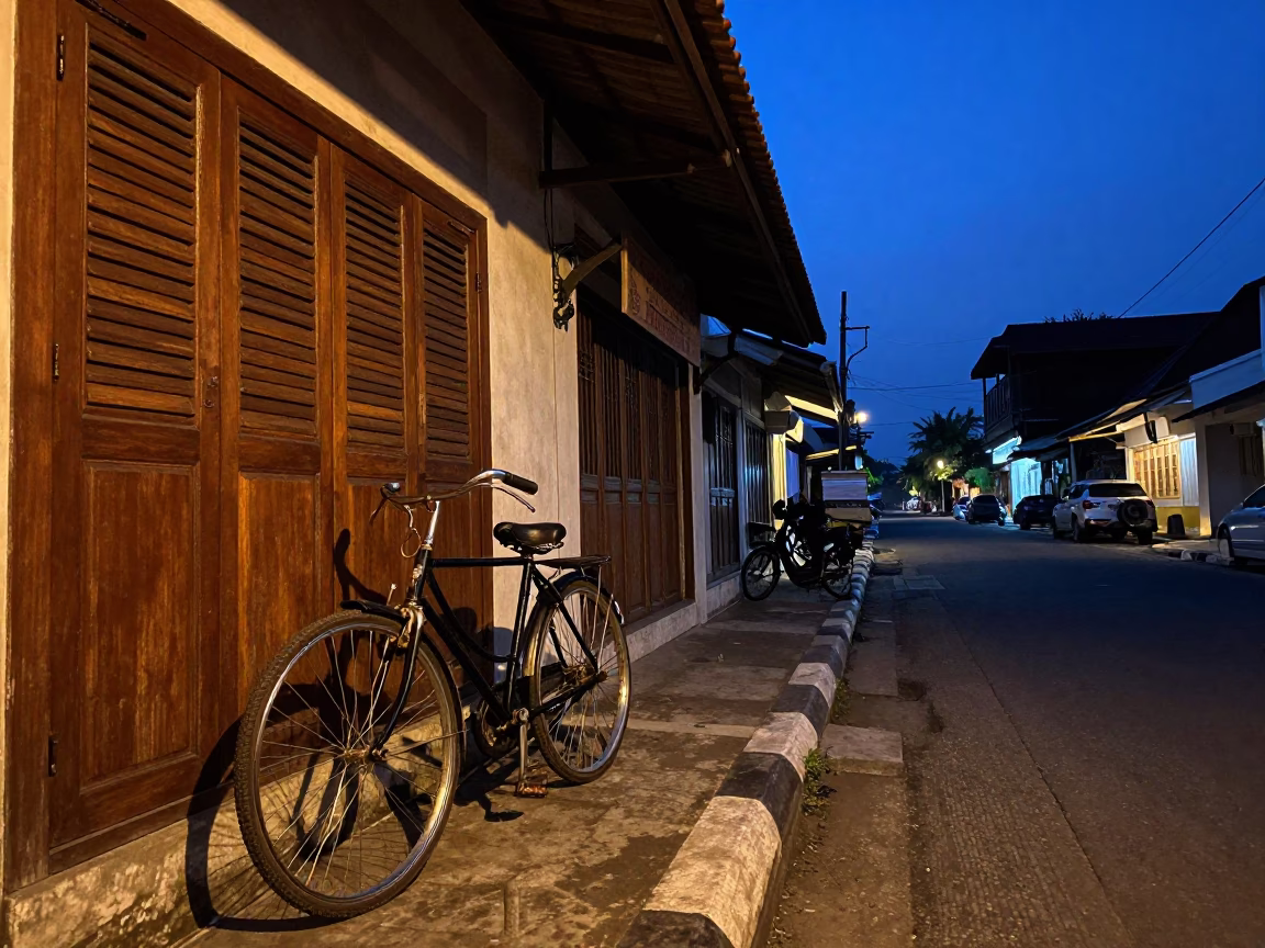 Yogyakarta Indonesia street scene at nautical dawn with bicycle and bakery in in Yogyakarta, Indonesia