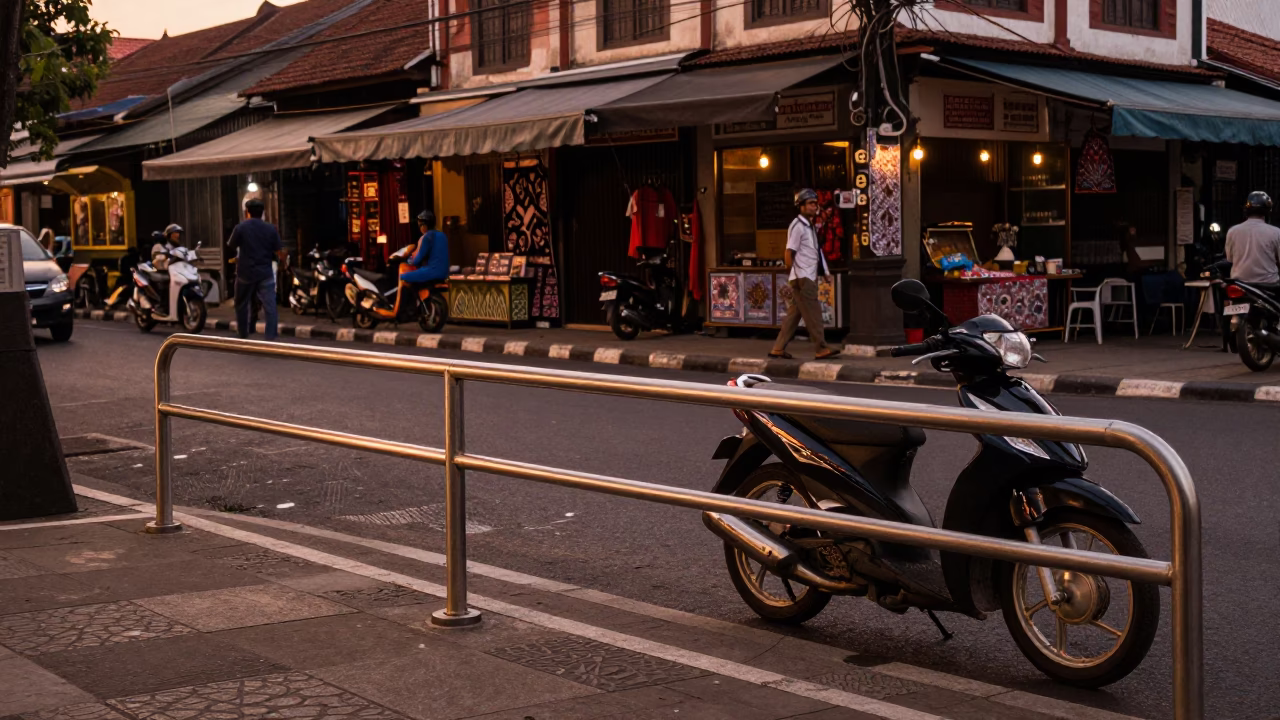 Yogyakarta Indonesia Street Scene Before Dusk with Brushed Steel Rail and Local Market Activity in in Yogyakarta, Indonesia
