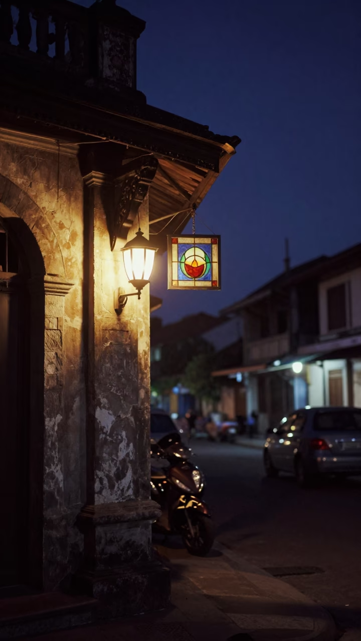 Yogyakarta Night Street Scene with Tea Stained Glass and Wall Sconce Lighting in in Yogyakarta, Indonesia