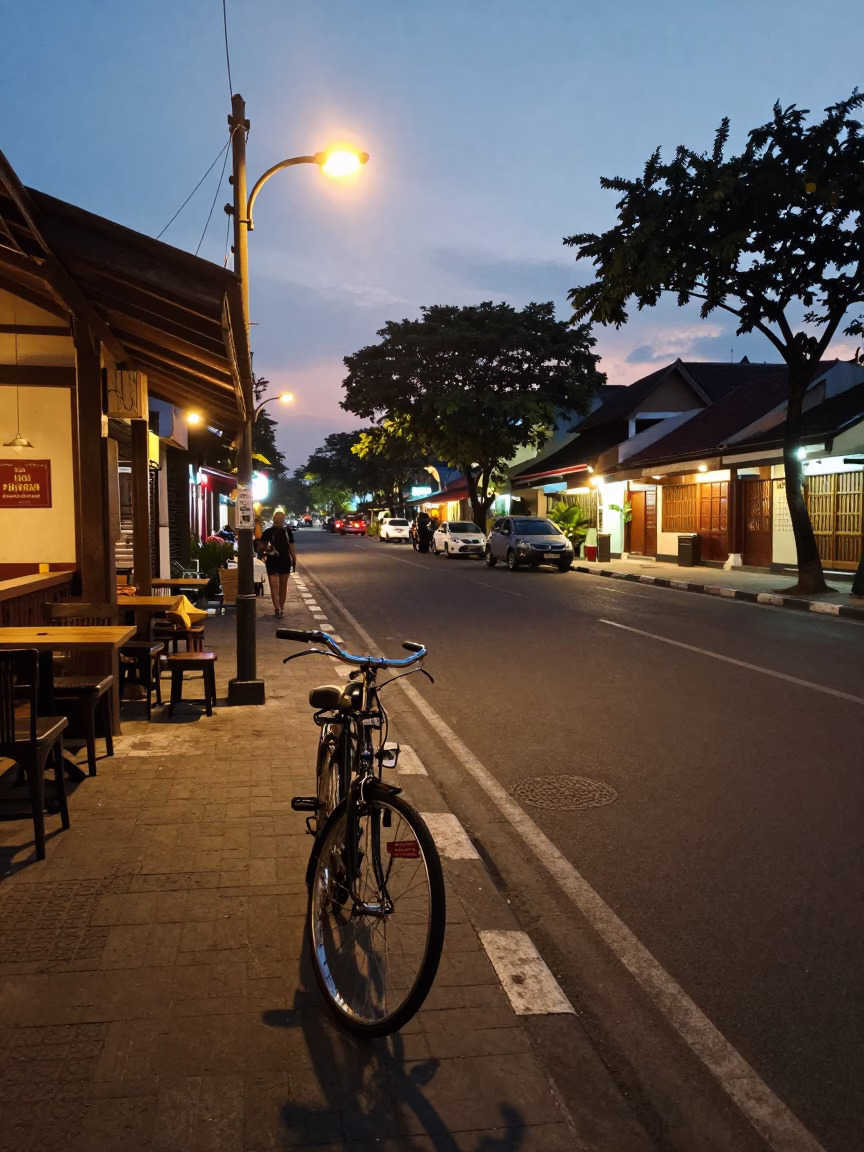 Yogyakarta Street Scene at Dusk with Bicycle and Tea Tray in in Yogyakarta, Indonesia