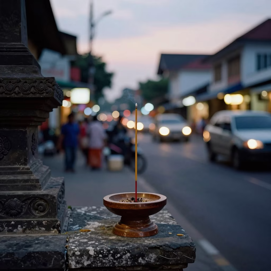 Yogyakarta Street Scene at Dusk with Incense Holder and School Bell Schedule in in Yogyakarta, Indonesia