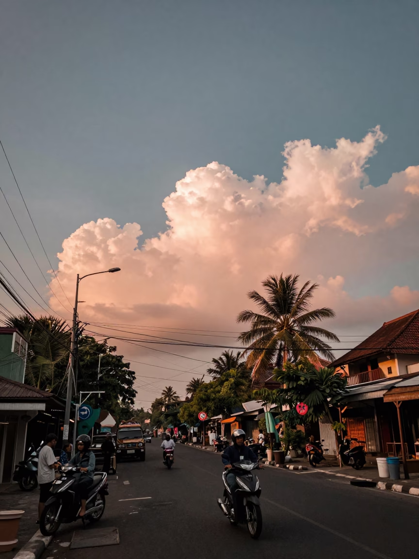 Yogyakarta Street Scene at Dusk with Morning Glory Clouds and Local Market Activity in in Yogyakarta, Indonesia