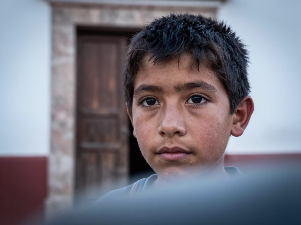 Young Shepherd Boy Dust Eyelashes Morelia in against a weathered doorway near Morelia