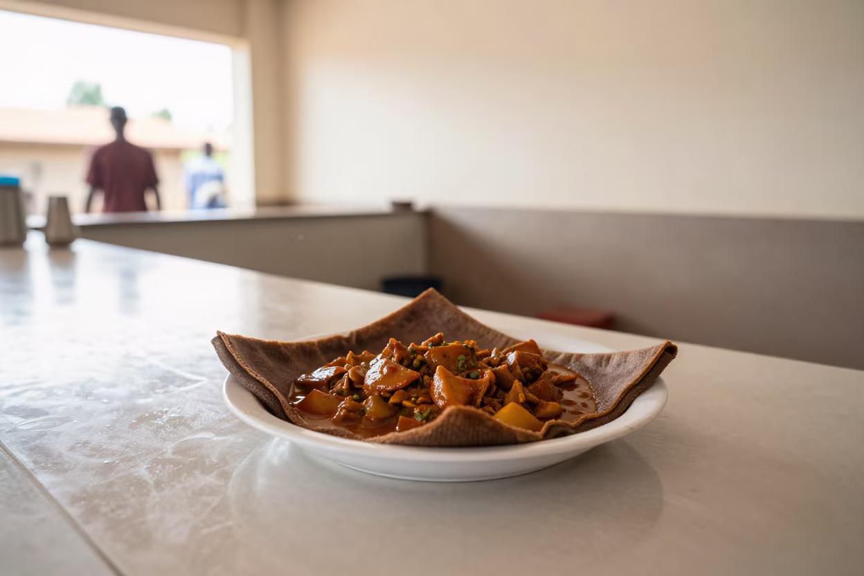 Zigni Stew and Injera on Noodle Counter in at a noodle counter in Ado Ekiti