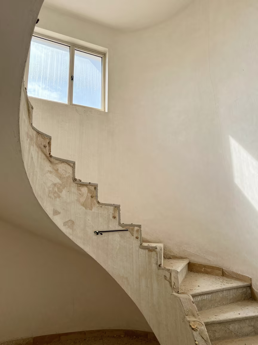 Zipper Patch Kit on Stair Tower Wall in Algeria in inside a bare shell stair tower in Algeria